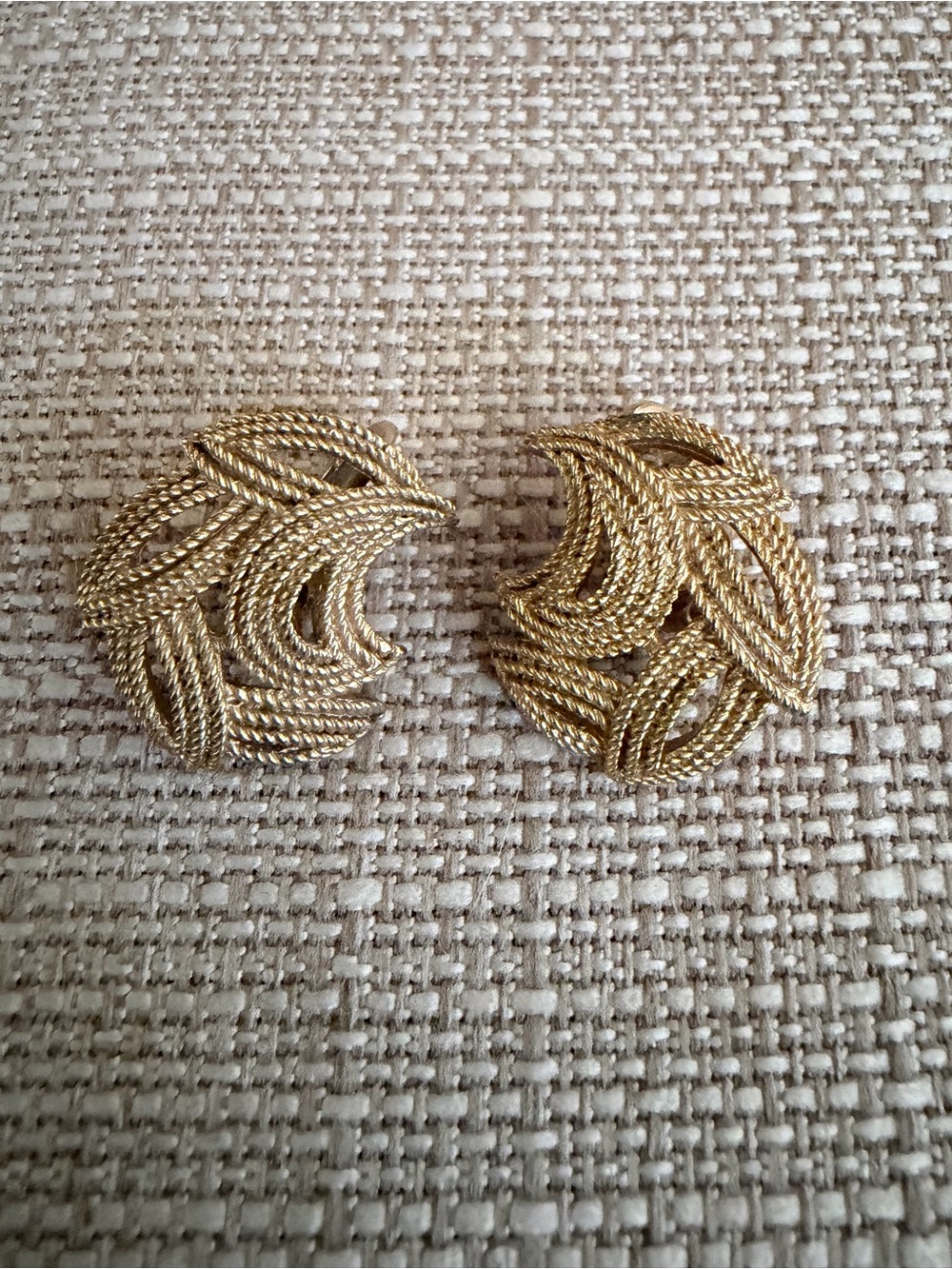 Vintage 1960s Crown Trifari gold tone textured swirl crescent clip-on earrings